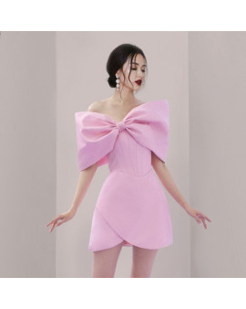 夏季新款性感一字肩a字裙优雅风网纱拼接蝴蝶结粉鱼骨收腰连衣裙